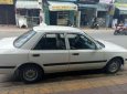 Mazda 323    MT 1995 - Bán xe Mazda 323 MT sản xuất 1995, màu trắng