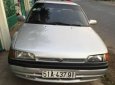 Mazda 323   1995 - Bán xe cũ Mazda 323 đời 1995, màu bạc xe gia đình