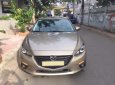 Mazda 3 2016 - Bán chiếc Mazda 3 2016 sedan dáng thể thao màu vàng cát