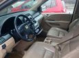 Honda Odyssey 2006 - Cần bán Honda Odyssey sản xuất 2006, màu ghi vàng  