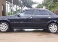 Ford Laser GHIA 1.8 MT 2004 - Cần bán gấp Ford Laser GHIA 1.8 MT năm 2004, màu đen