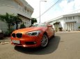 BMW 1 Series  116i  2014 - Chính chủ bán BMW 1 Series 116i đời 2014, màu cam