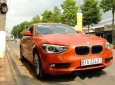 BMW 1 Series  116i  2014 - Chính chủ bán BMW 1 Series 116i đời 2014, màu cam