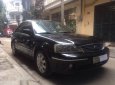 Ford Laser   Ghia 1.8 2004 - Cần bán lại xe Ford Laser Ghia 1.8 sản xuất 2004, màu đen số tự động