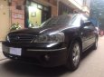 Ford Laser   Ghia 1.8 2004 - Cần bán lại xe Ford Laser Ghia 1.8 sản xuất 2004, màu đen số tự động