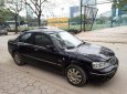 Ford Laser GHIA 1.8 AT 2004 - Cần bán lại xe Ford Laser GHIA 1.8 AT đời 2004, màu đen, giá 236tr
