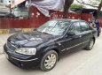 Ford Laser GHIA 1.8 AT 2004 - Cần bán lại xe Ford Laser GHIA 1.8 AT đời 2004, màu đen, giá 236tr