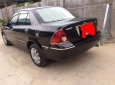 Ford Laser Ghia 1.8 AT 2005 - Cần bán gấp Ford Laser Ghia 1.8 AT đời 2005, màu đen chính chủ