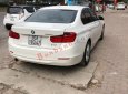 BMW 3 Series 320i 2014 - Cần bán lại xe BMW 3 Series 320i đời 2014, màu trắng, xe nhập