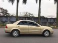 Ford Laser GHIA 1.8 AT 2004 - Cần bán gấp Ford Laser GHIA 1.8 AT năm sản xuất 2004, màu vàng số tự động, 238 triệu