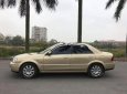 Ford Laser GHIA 1.8 AT 2004 - Cần bán gấp Ford Laser GHIA 1.8 AT năm sản xuất 2004, màu vàng số tự động, 238 triệu