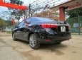 Toyota Corolla altis 2016 - Cần bán Toyota Corolla altis năm sản xuất 2016, màu đen xe gia đình, giá chỉ 690 triệu