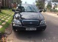 Kia Carnival 2009 - Cần bán Kia Carnival đời 2009, màu đen, 319 triệu