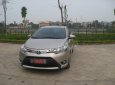 Toyota Vios E 2015 - Bán ô tô Toyota Vios E sản xuất năm 2015, màu vàng cát