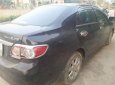 Toyota Corolla altis 1.8MT 2011 - Cần bán gấp Toyota Corolla Altis 1.8MT đời 2011, màu đen chính chủ, giá tốt