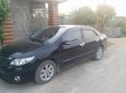 Toyota Corolla altis 1.8MT 2011 - Cần bán gấp Toyota Corolla Altis 1.8MT đời 2011, màu đen chính chủ, giá tốt