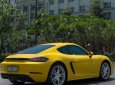 Porsche Cayman 718 2017 - Cần bán lại xe Porsche Cayman 718 2017, màu vàng, nhập khẩu nguyên chiếc như mới