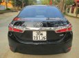 Toyota Corolla altis 1.8AT 2016 - Cần bán lại xe Toyota Corolla Altis 1.8AT đời 2016, màu đen xe gia đình, giá tốt