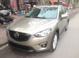 Mazda CX 5 2WD 2013 - Cần bán xe Mazda CX-5, sản xuất và đăng ký 2013 mầu vàng cát. Giá 665 triệu