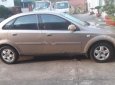 Daewoo Lacetti EX 1.6 MT 2004 - Chính chủ bán xe Daewoo Lacetti EX 1.6 MT đời 2004, màu vàng cát