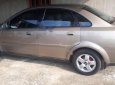 Daewoo Lacetti EX 1.6 MT 2004 - Chính chủ bán xe Daewoo Lacetti EX 1.6 MT đời 2004, màu vàng cát