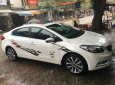 Kia K3 2.0 AT 2015 - Bán Kia K3 2.0 sản xuất 2015, màu trắng đã đi 30.000km, 590tr