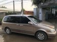 Kia Carnival 2009 - Bán Kia Carnival 2009, màu vàng  