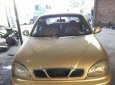 Daewoo Lanos SX 2002 - Bán Daewoo Lanos SX năm 2002, màu vàng cát