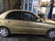 Daewoo Lanos SX 2002 - Bán Daewoo Lanos SX năm 2002, màu vàng cát