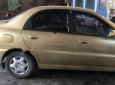 Daewoo Lanos SX 2002 - Bán Daewoo Lanos SX năm 2002, màu vàng cát