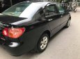 Toyota Corona  G 1.8  2004 - Cần bán gấp Toyota Corona G 1.8 sản xuất 2004, màu đen số sàn