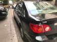 Toyota Corona  G 1.8  2004 - Cần bán gấp Toyota Corona G 1.8 sản xuất 2004, màu đen số sàn