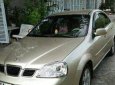 Daewoo Lacetti 2004 - Cần lên 7 chỗ bán Daewoo Lacetti đời 2004, màu vàng