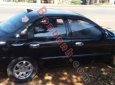 Kia Spectra 1.6 MT 2003 - Cần bán Kia Spectra 1.6 MT đời 2003, màu đen, giá 128tr