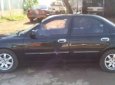 Kia Spectra 1.6 MT 2003 - Cần bán Kia Spectra 1.6 MT đời 2003, màu đen, giá 128tr