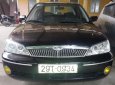 Ford Laser GHIA 2003 - Cần bán xe Ford Laser GHIA sản xuất năm 2003, màu đen, 215 triệu