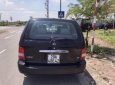 Kia Carnival GS 2.5 AT 2009 - Bán Kia Carnival GS 2.5 AT sản xuất năm 2009, màu đen  