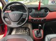 Hyundai Grand i10 1.2AT 2015 - Cần bán gấp Hyundai Grand i10 1.2AT năm sản xuất 2015, màu đỏ, nhập khẩu