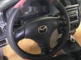 Mazda 323 2004 - Bán Mazda 323 đời 2004, màu đen, giá 180tr