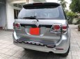 Toyota Fortuner 2013 - Cần bán gấp Toyota Fortuner sản xuất 2013, màu bạc số tự động