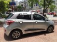 Hyundai Grand i10   1.0AT 2015 - Cần bán gấp Hyundai Grand i10 1.0AT 2015, màu bạc, giá tốt