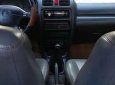 Mazda 323   1999 - Bán ô tô Mazda 323 năm 1999, màu đen, số sàn