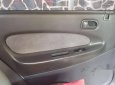 Mazda 323 2000 - Cần bán xe Mazda 323 đời 2000, màu trắng chính chủ 
