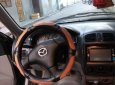 Mazda 323 2004 - Gia đình bán Mazda 323 2004, màu đen, 150tr