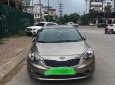 Kia K3 1.6AT 2014 - Bán Kia K3 1.6AT đời 2014, màu vàng cát