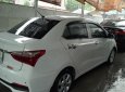 Hyundai Grand i10 1.2 AT 2018 - Cần bán lại xe Hyundai Grand i10 1.2 AT sản xuất 2018, màu trắng như mới