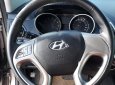 Hyundai Tucson 2.0 AT 4WD 2011 - Cần bán Hyundai Tucson 2.0 AT 4WD năm 2011, màu xám, xe nhập  