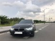 BMW 3 Series  320i  2017 - Bán xe BMW 320i năm 2017, màu đen như mới