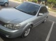 Ford Laser LXi 1.6 MT 2004 - Cần bán gấp Ford Laser LXi 1.6 MT 2004, màu bạc như mới