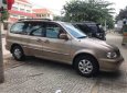 Kia Carnival 2009 - Cần bán Kia Carnival 2009, màu nâu số tự động, 245tr